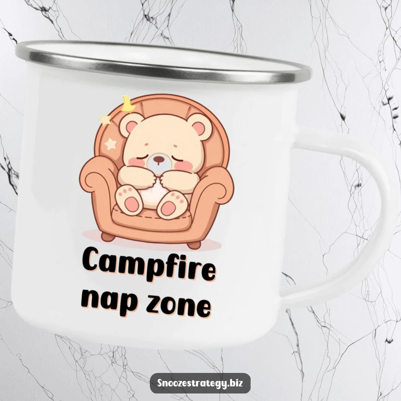 Funny camping mug showing a peaceful bear cub character asleep in a cozy armchair, perfect for rustic relaxation.