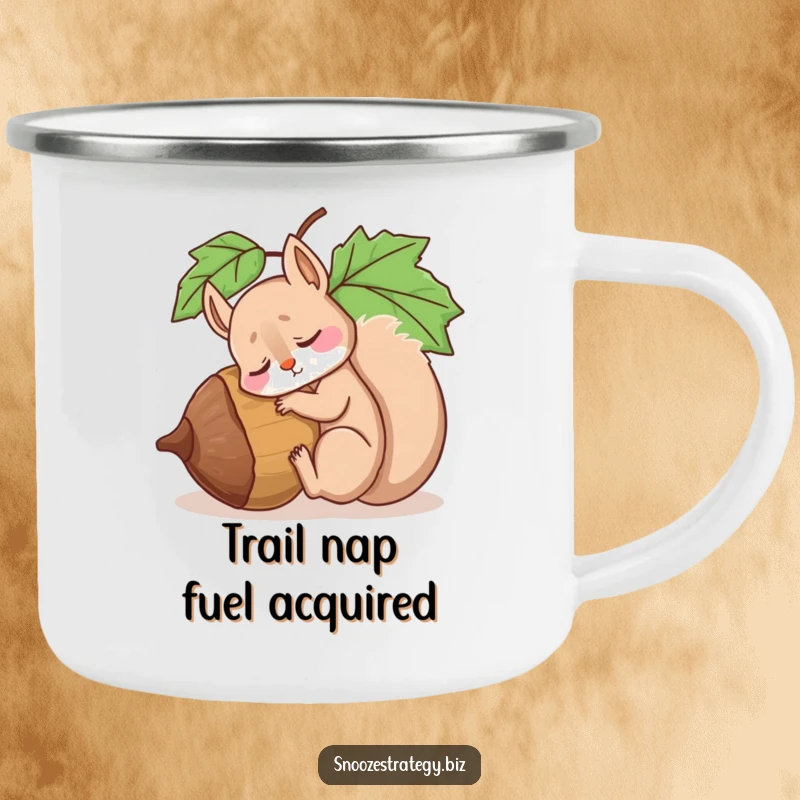 Funny camping mug showing a drowsy squirrel character asleep against a giant acorn, ready for outdoor relaxation and warm drinks.