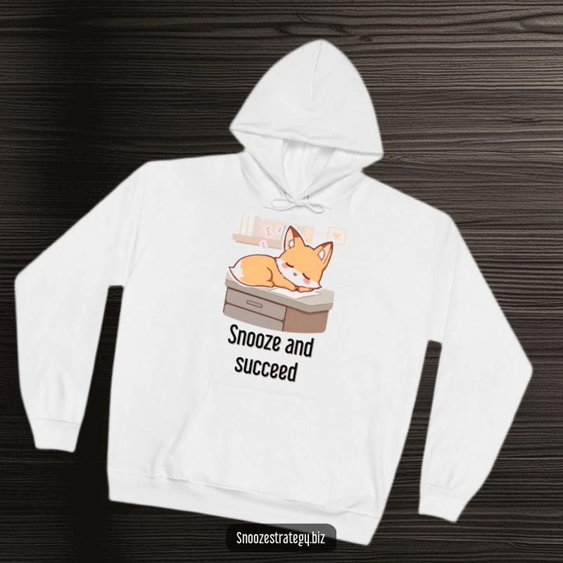 Funny Fox Desk Hoodie: A sleepy fox character dreams gently on a desk, offering supreme comfort and a touch of whimsical humor.